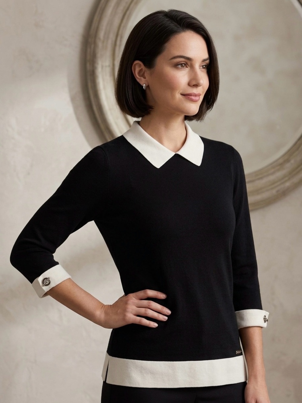 Calvin Klein black knit top with a white contrast collar and cuffs